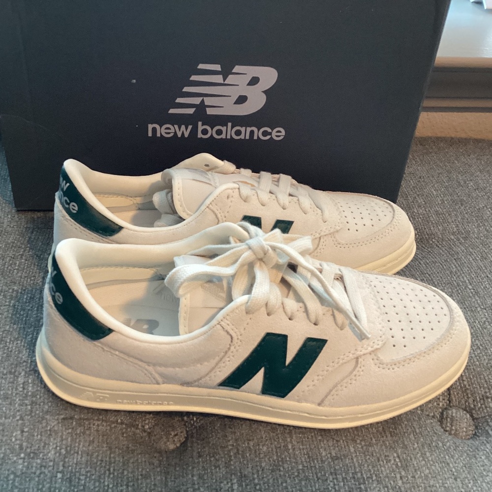 New Balance White Sneakers with Dark Green Logo